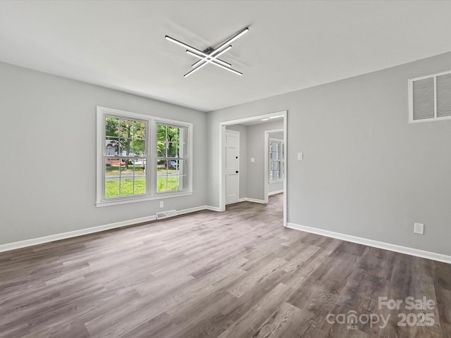 2544 Cedarwild Rd, Charlotte, NC 28212 - unfurnished room featuring baseboards, visible vents, and wood finished floors