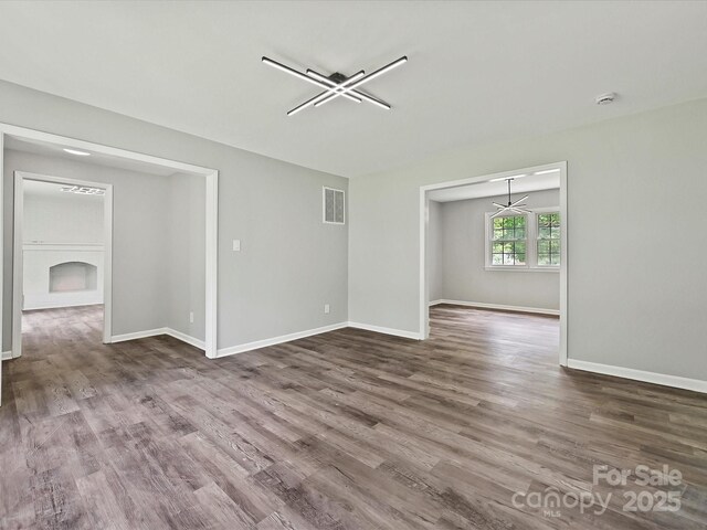 2544 Cedarwild Rd, Charlotte, NC 28212 - unfurnished room featuring baseboards, wood finished floors, and visible vents