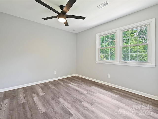 2544 Cedarwild Rd, Charlotte, NC 28212 - unfurnished room with baseboards, a ceiling fan, wood finished floors, and visible vents