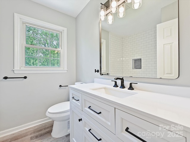 2544 Cedarwild Rd, Charlotte, NC 28212 - bathroom with vanity, wood finished floors, toilet, baseboards, and a tile shower
