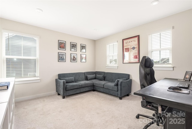office area featuring recessed lighting, baseboards, light colored carpet, and a healthy amount of sunlight