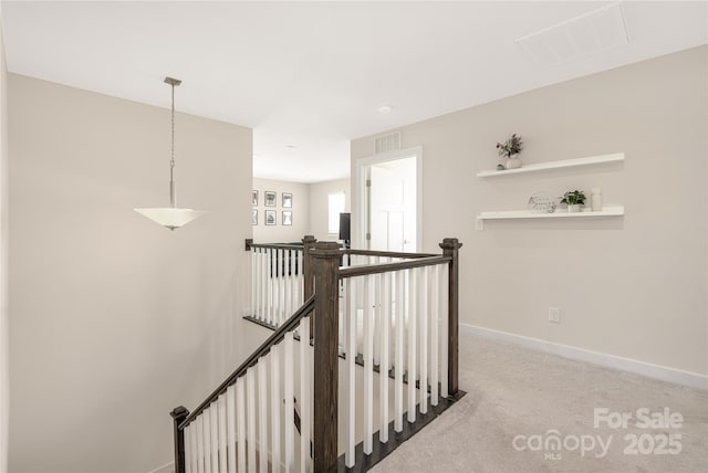 stairs featuring baseboards, carpet, and visible vents