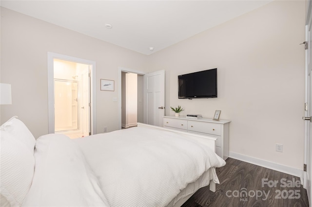 bedroom featuring baseboards and dark wood-style floors