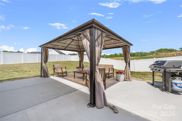 view of patio / terrace featuring a gazebo, a fenced backyard, and area for grilling