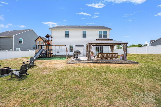 back of house featuring a patio area, a gazebo, a fenced backyard, a playground, and an outdoor fire pit