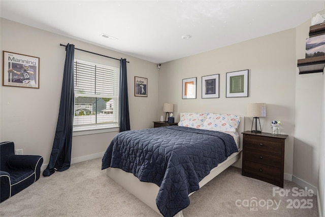 bedroom featuring visible vents, baseboards, and carpet floors