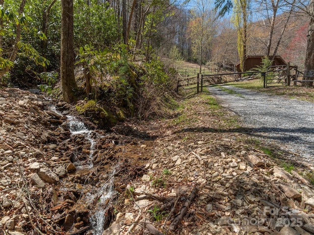 90 Junco Trl, Waynesville, NC 28785 - view of road with driveway, a gated entry, and a gate