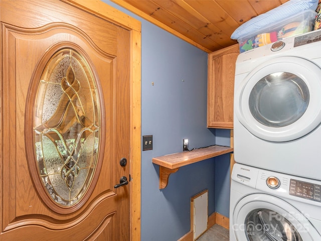 90 Junco Trl, Waynesville, NC 28785 - washroom featuring baseboards, wooden ceiling, cabinet space, and stacked washer / drying machine