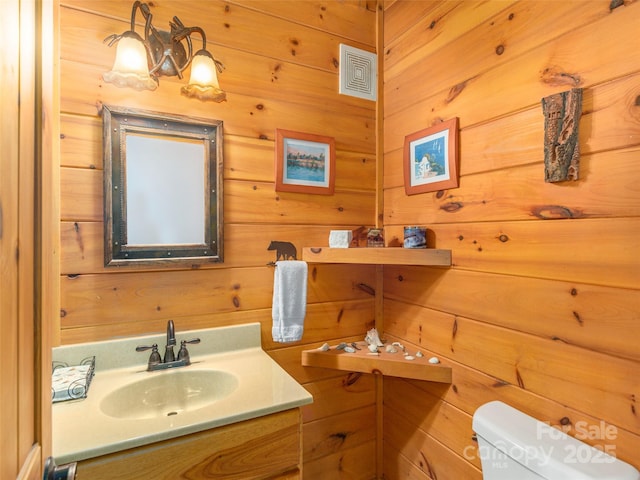 90 Junco Trl, Waynesville, NC 28785 - bathroom featuring wood walls, visible vents, toilet, and vanity