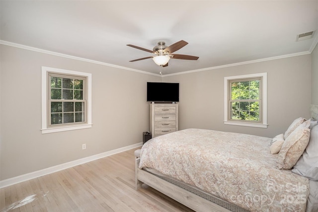 bedroom with wood finished floors, baseboards, ornamental molding, and ceiling fan