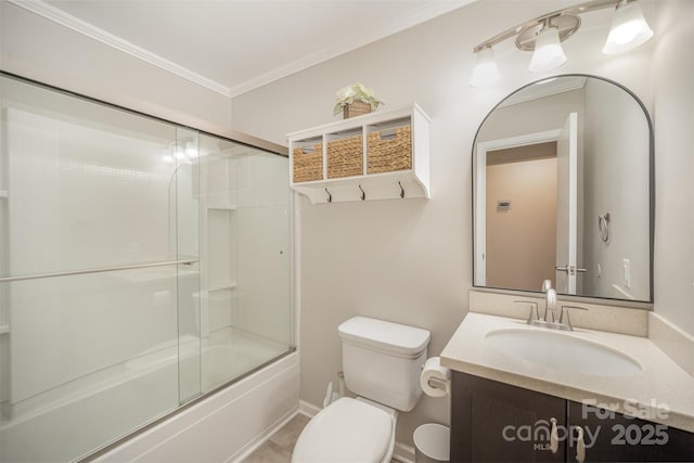 full bathroom with toilet, vanity, crown molding, combined bath / shower with glass door, and baseboards