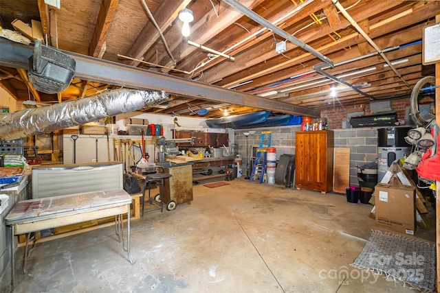 unfinished basement with a workshop area