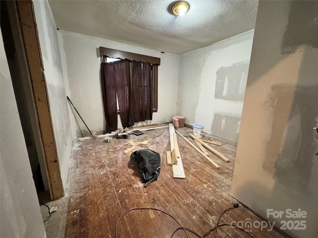 1703 Lowder St, Albemarle, NC 28001 - interior space featuring wood-type flooring and a textured ceiling