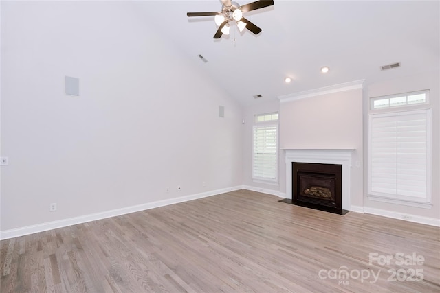 unfurnished living room with ceiling fan, light wood-style floors, a fireplace with flush hearth, baseboards, and recessed lighting