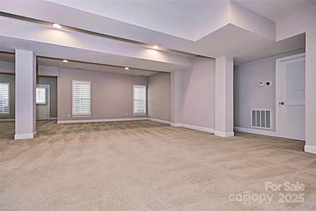 basement with carpet flooring, baseboards, plenty of natural light, and recessed lighting