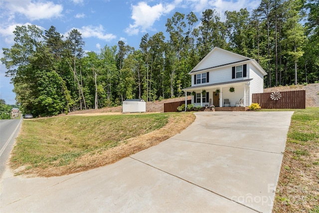 658 Morgan Rd, Albemarle, NC 28001 - view of front facade with a porch, driveway, and a front lawn
