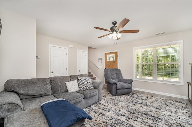 658 Morgan Rd, Albemarle, NC 28001 - living area with visible vents, stairs, wood finished floors, baseboards, and ceiling fan