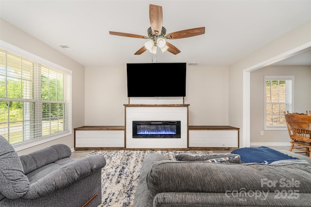 658 Morgan Rd, Albemarle, NC 28001 - living area with baseboards, a ceiling fan, a wealth of natural light, and visible vents