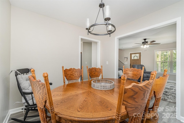 658 Morgan Rd, Albemarle, NC 28001 - dining space with baseboards, ceiling fan with notable chandelier, and wood finished floors