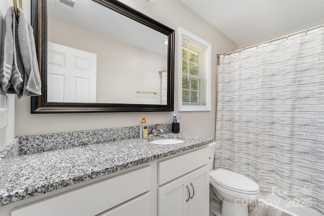658 Morgan Rd, Albemarle, NC 28001 - bathroom featuring toilet, visible vents, and vanity