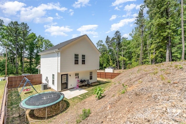 658 Morgan Rd, Albemarle, NC 28001 - back of property featuring fence, a trampoline, central AC unit, and a patio area