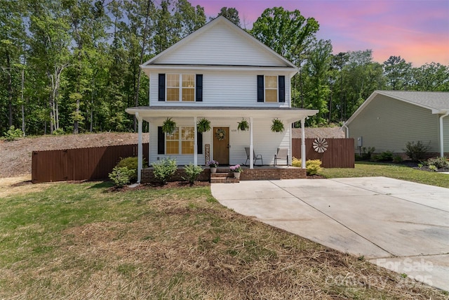 658 Morgan Rd, Albemarle, NC 28001 - view of front of home with fence, covered porch, and a yard