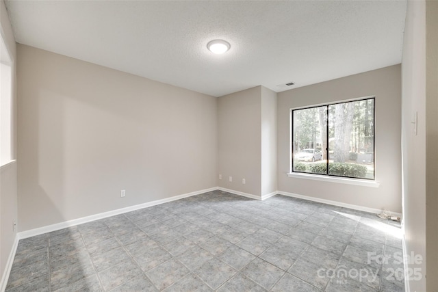 173 Greenridge Rd, Lake Wylie, SC 29710 - spare room featuring a textured ceiling and baseboards