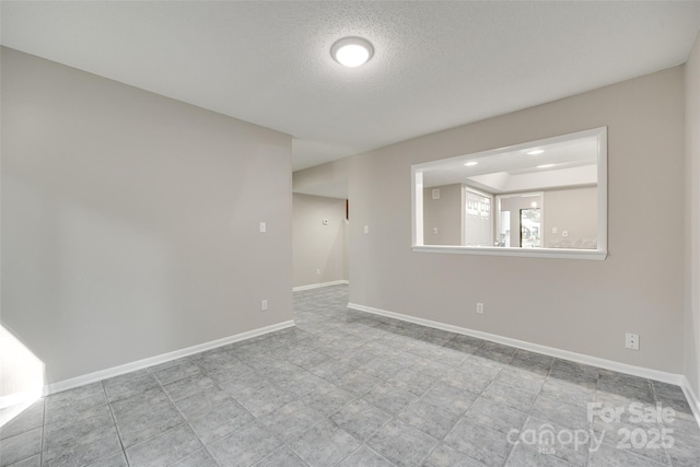 173 Greenridge Rd, Lake Wylie, SC 29710 - spare room featuring a textured ceiling and baseboards