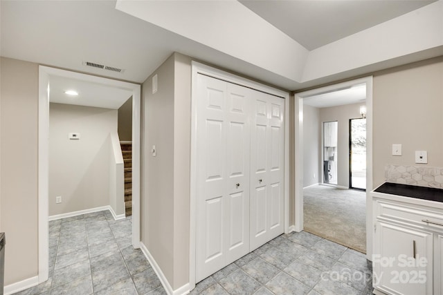 173 Greenridge Rd, Lake Wylie, SC 29710 - corridor featuring baseboards, stairs, and light stone finish floors
