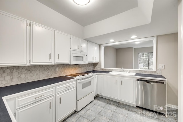 173 Greenridge Rd, Lake Wylie, SC 29710 - kitchen featuring white appliances, a sink, dark countertops, tasteful backsplash, and recessed lighting