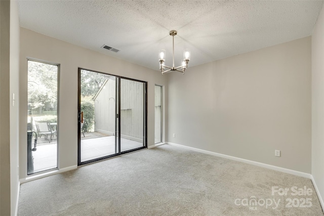 173 Greenridge Rd, Lake Wylie, SC 29710 - carpeted spare room with a chandelier, baseboards, and a textured ceiling