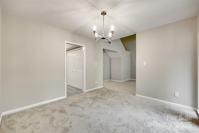 173 Greenridge Rd, Lake Wylie, SC 29710 - empty room with carpet, a chandelier, baseboards, and a textured ceiling