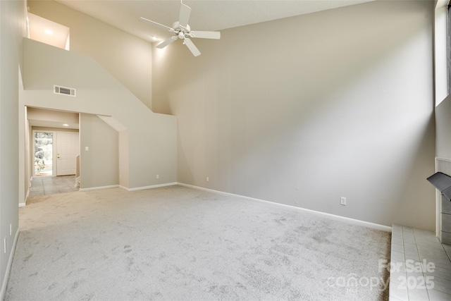 173 Greenridge Rd, Lake Wylie, SC 29710 - unfurnished living room featuring light carpet, a ceiling fan, baseboards, high vaulted ceiling, and a wood stove