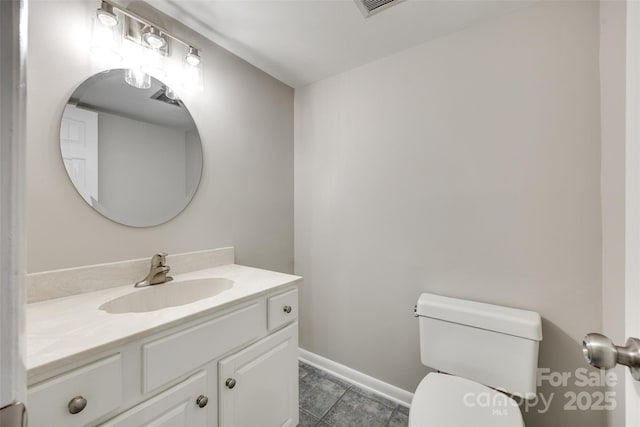173 Greenridge Rd, Lake Wylie, SC 29710 - half bathroom featuring toilet, vanity, baseboards, and tile patterned flooring