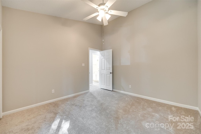 173 Greenridge Rd, Lake Wylie, SC 29710 - empty room featuring light carpet, baseboards, ceiling fan, and high vaulted ceiling