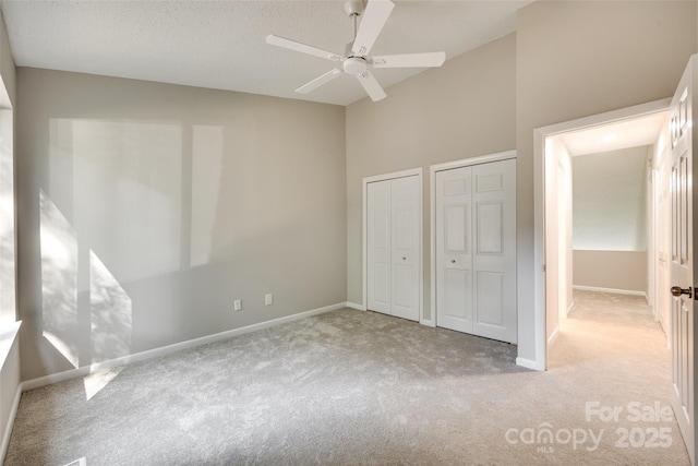 173 Greenridge Rd, Lake Wylie, SC 29710 - unfurnished bedroom with multiple closets, carpet, baseboards, and a ceiling fan