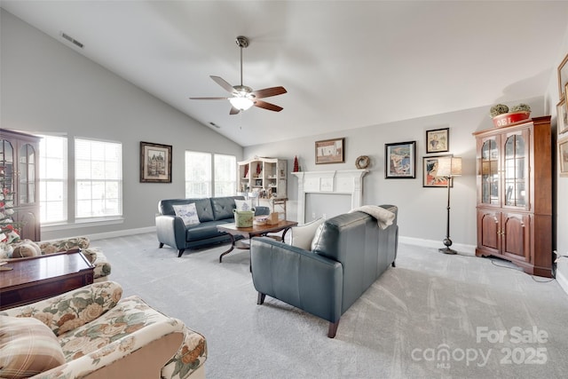 living area with baseboards, light carpet, a ceiling fan, and visible vents