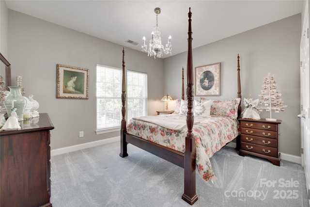 carpeted bedroom featuring a notable chandelier, baseboards, and visible vents