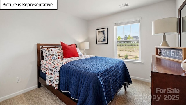 bedroom with visible vents, carpet, and baseboards