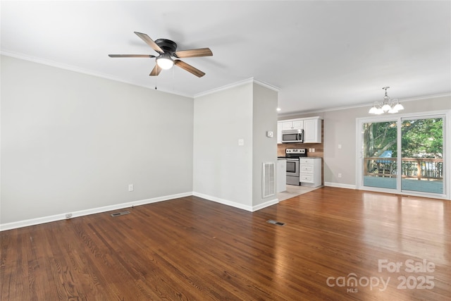unfurnished living room with crown molding, ceiling fan with notable chandelier, baseboards, wood finished floors, and visible vents