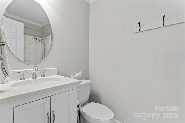 full bath featuring crown molding, toilet, and vanity
