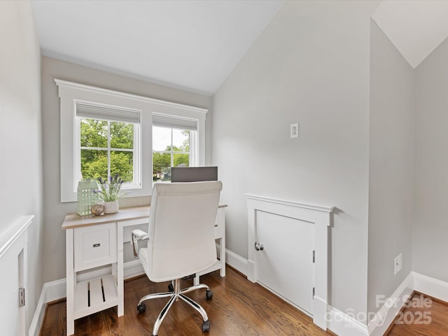office space featuring wood finished floors, vaulted ceiling, and baseboards