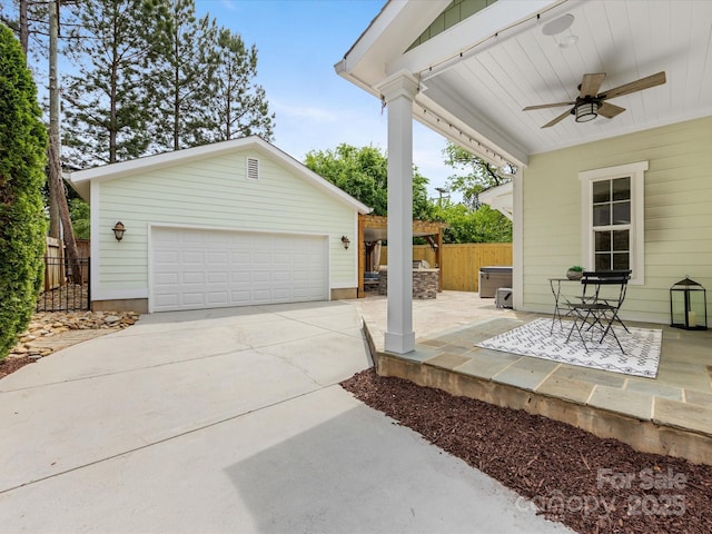 view of patio featuring fence and ceiling fan