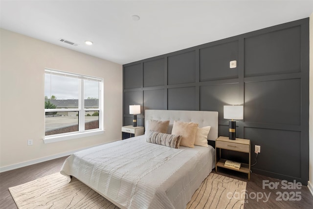 3630 N Davidson St Unit 3301, Charlotte, NC 28205 - bedroom with visible vents, baseboards, a decorative wall, recessed lighting, and light wood-style flooring