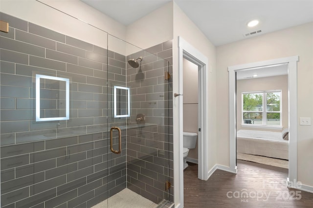 3630 N Davidson St Unit 3301, Charlotte, NC 28205 - full bathroom with baseboards, a stall shower, toilet, and wood finished floors