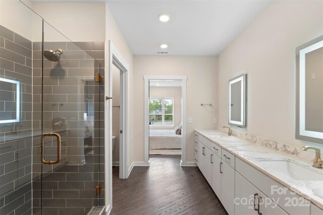 3630 N Davidson St Unit 3301, Charlotte, NC 28205 - ensuite bathroom with a sink, ensuite bathroom, a shower stall, and wood finished floors