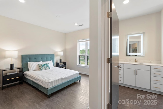 3630 N Davidson St Unit 3301, Charlotte, NC 28205 - bedroom featuring visible vents, a sink, dark wood-style flooring, and recessed lighting