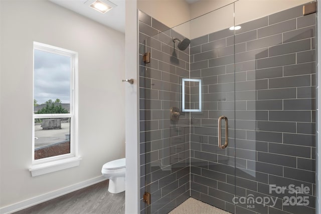3630 N Davidson St Unit 3301, Charlotte, NC 28205 - full bathroom with baseboards, a stall shower, toilet, and wood finished floors