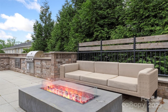 3630 N Davidson St Unit 3301, Charlotte, NC 28205 - view of patio with an outdoor kitchen, an outdoor living space with a fire pit, and fence