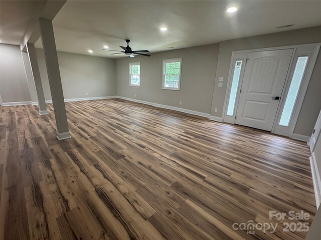 interior space featuring visible vents, baseboards, ceiling fan, dark wood-type flooring, and recessed lighting